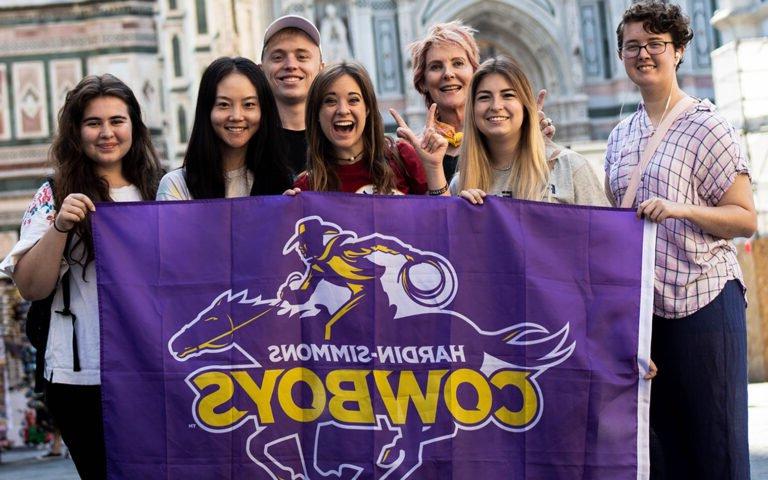 Photo of students holding HSU spirit banner.